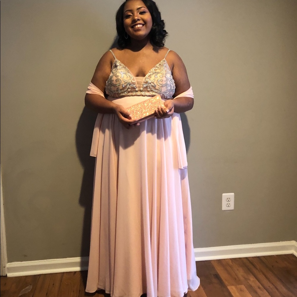 Pink glittery prom dress with spaghetti straps.